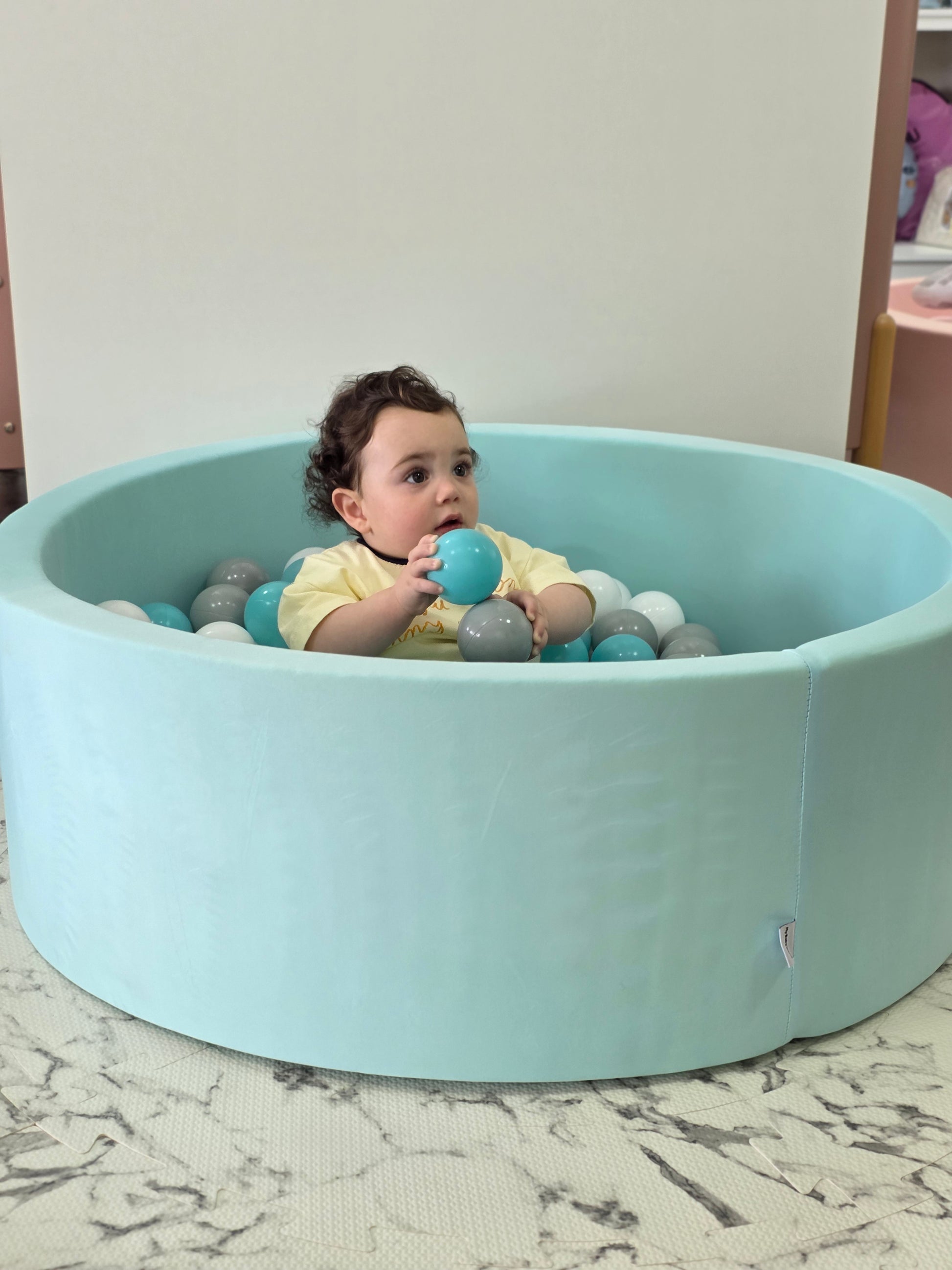 Ball pool pit includes 200 balls